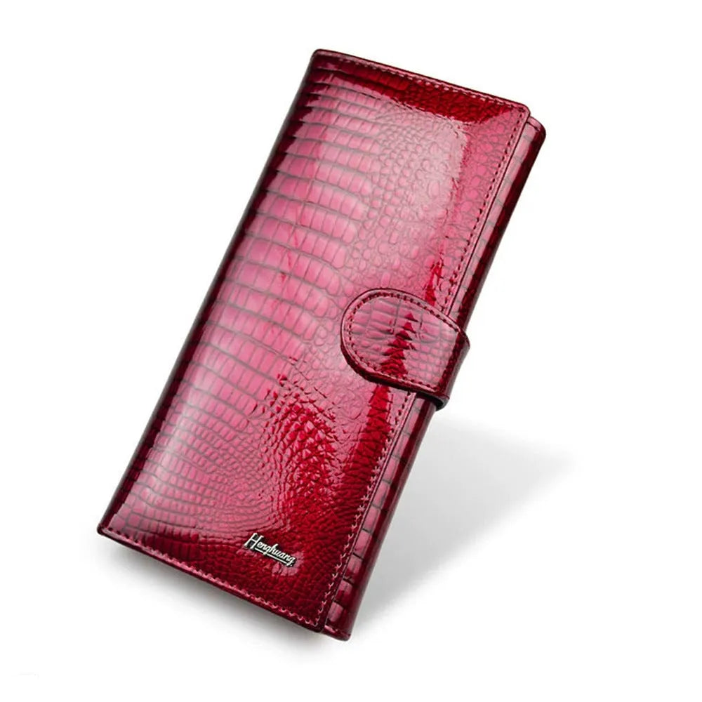 Women's patent leather coin purse with crocodile pattern in red, black, and wine red colours