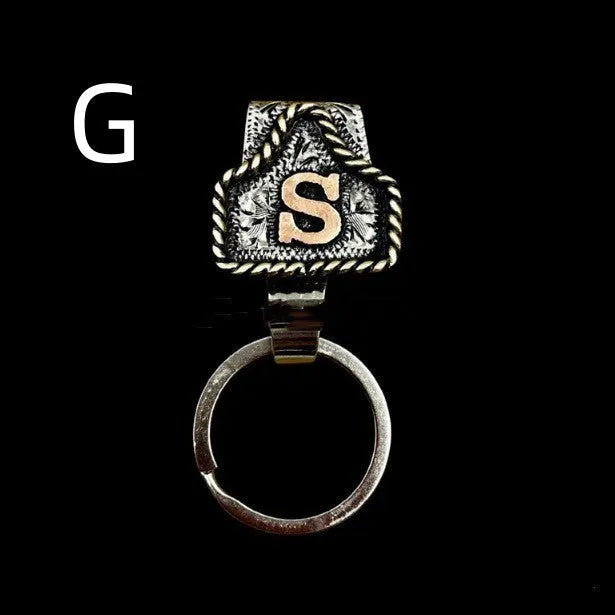 Handmade stainless steel cow tag belt key holder with engraved number plate on a split ring.