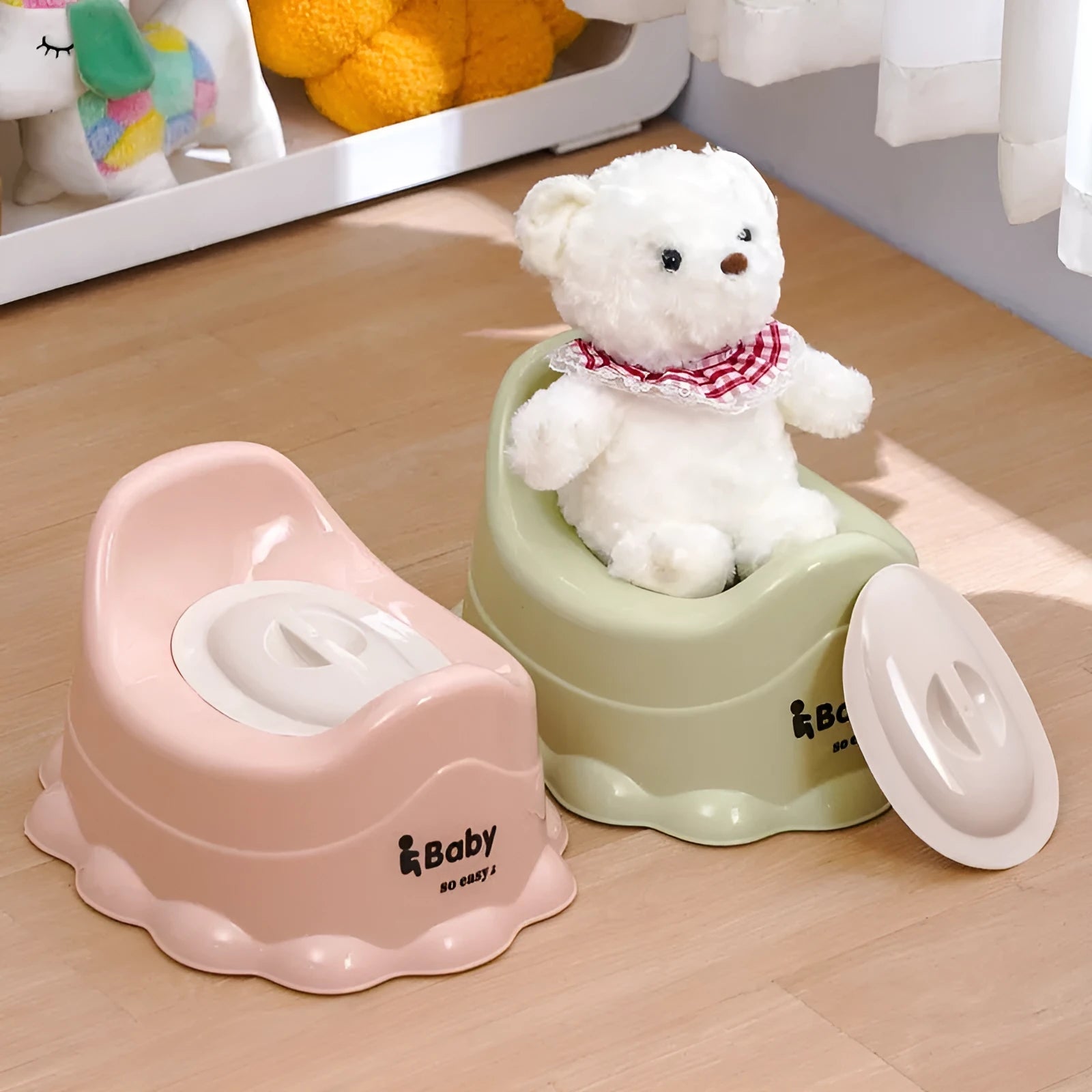 Children's small portable thickened toilet in green with lid, made of PP plastic, front view