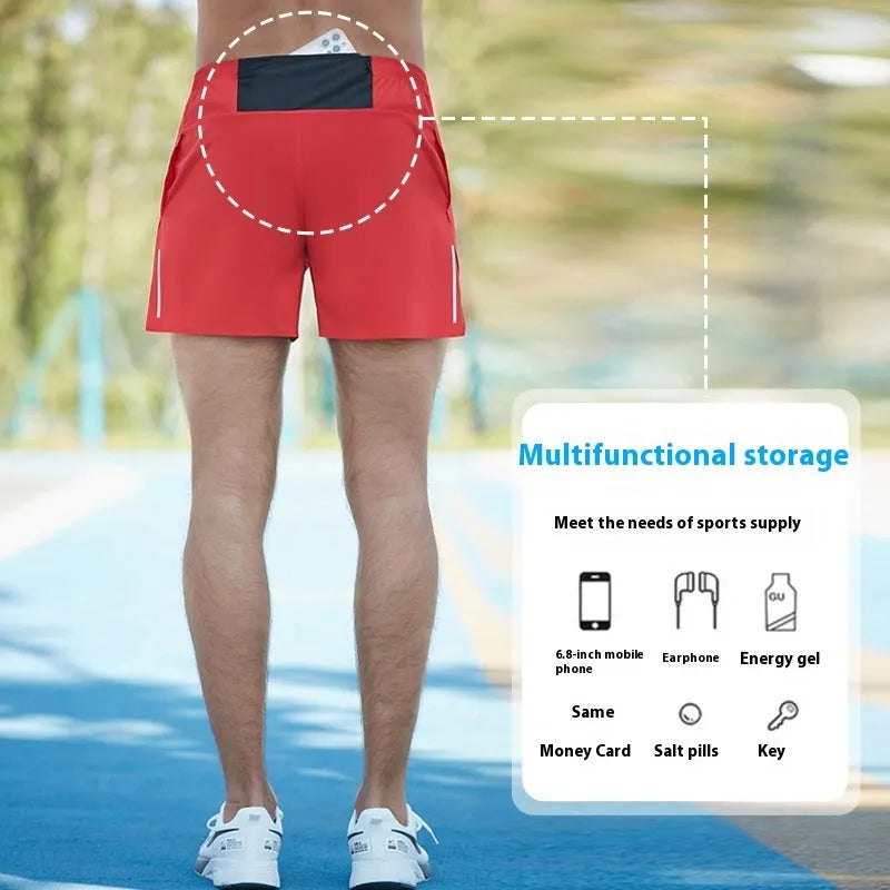 Men's loose fit off-road running shorts in grey, shown from front, with high waist and quick-dry fabric.