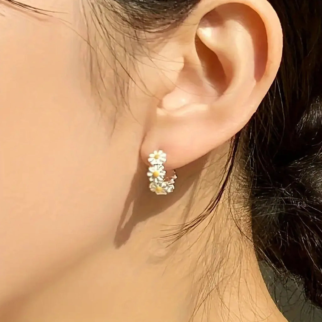 White daisy flower ring drop earrings with electroplated copper construction and platinum inlaid gem detailing