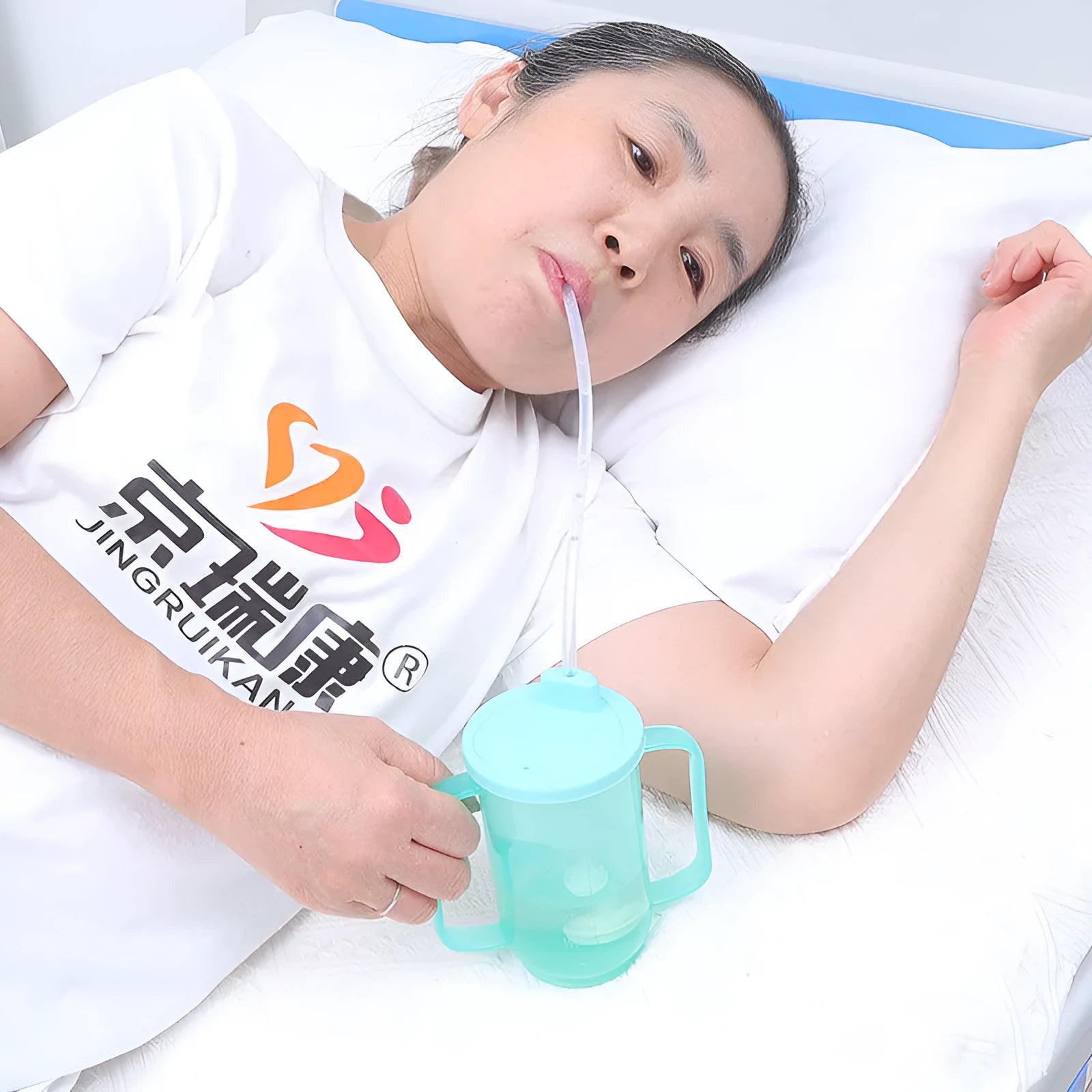 Oblique anti-choke drinking cup with handle and lid for bed use by elderly or pregnant women
