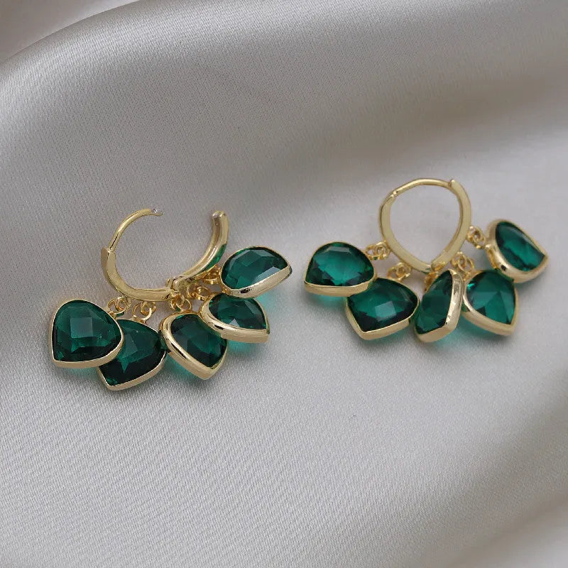 Green heart-shaped ear clip earrings with dancing shade design and artificial gemstones