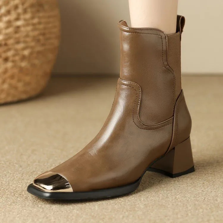 Brown slim-fit women's Martin boots with high heel and side zip on a white background