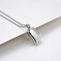 Silver curved peach heart pendant necklace on adjustable stainless steel chain