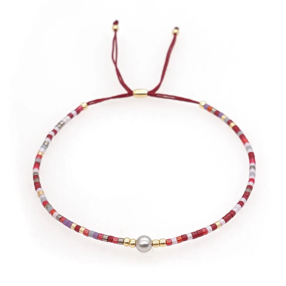 Handmade bohemian-style bracelet with colourful geometric glass beads for women.