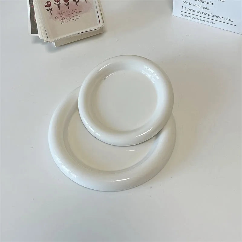 White ceramic plate with doodle design showing bear pattern, suitable for microwave use