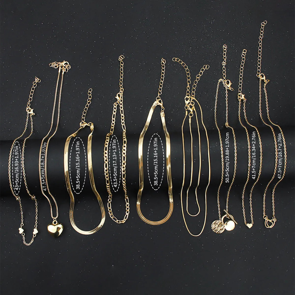 10-piece gold electroplated women's necklace set with alloy pendants on adjustable snake bone chain