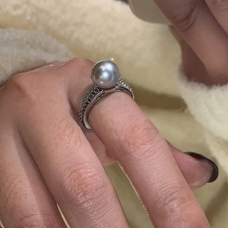 Adjustable black pearl copper ring with geometric open design for women