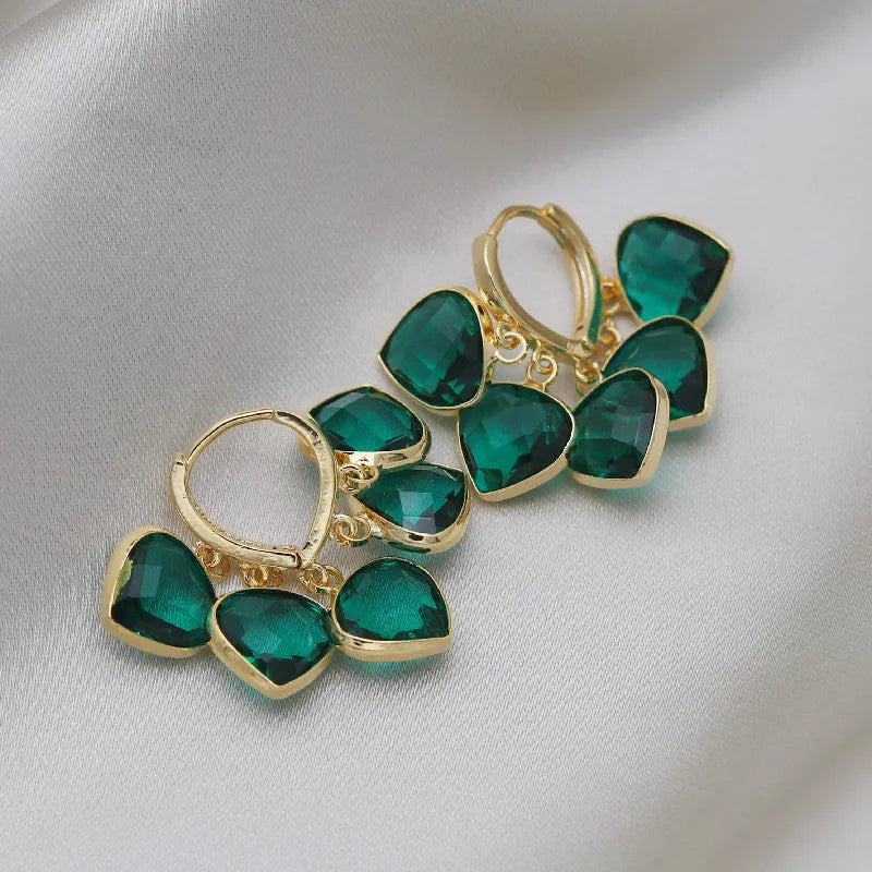 Green heart-shaped ear clip earrings with dancing shade design and artificial gemstones