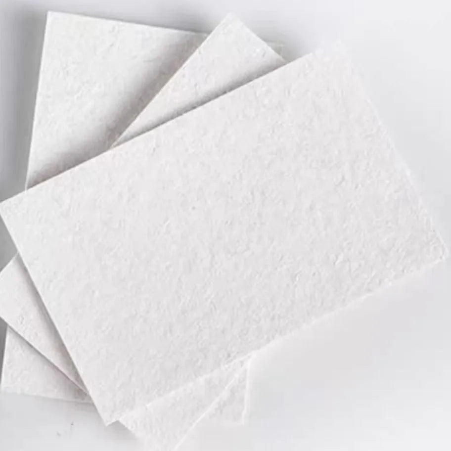 Wood pulp paper set showing square, heart, and round sheets with six fountain pens for art