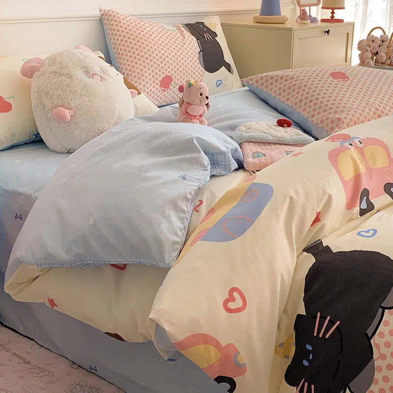 Cartoon dog pattern pure cotton four-piece duvet cover and pillowcase set on a bed.