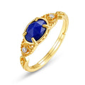 Women's ellipse geometric ring with round blue Lapis Lazuli stone on silver alloy band.