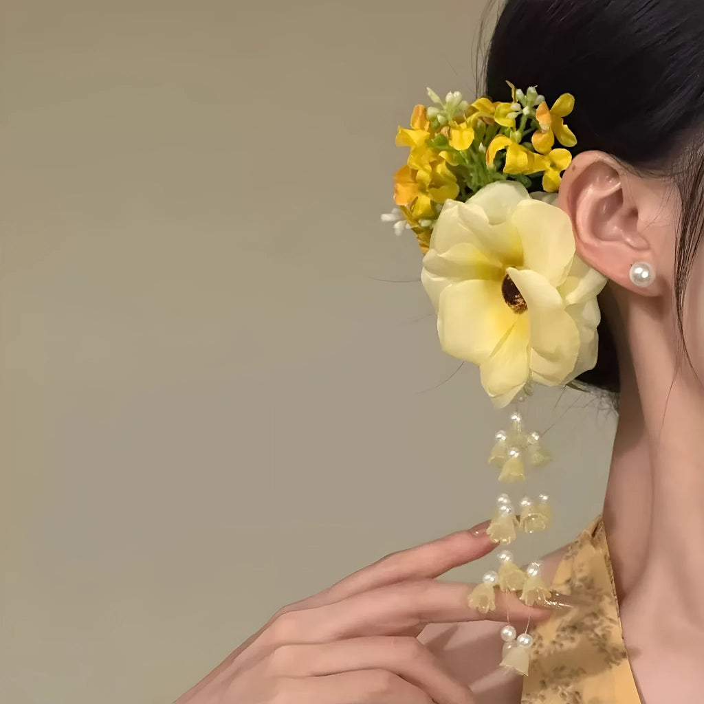 Women's floral tassel hair accessory with side clip in purple or yellow colour options