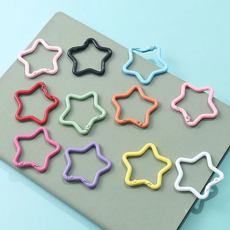 Zinc alloy five-pointed star keychain in a choice of macaron colours for bag decoration.
