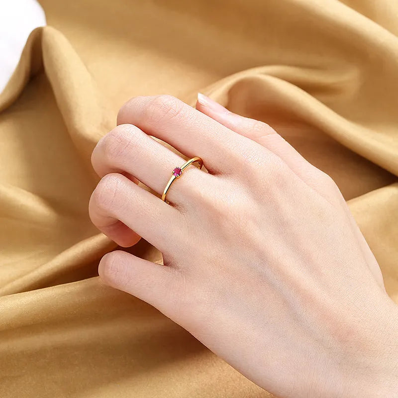 Copper geometric circle ring for women with a single diamond detail, shown in multiple colour options.