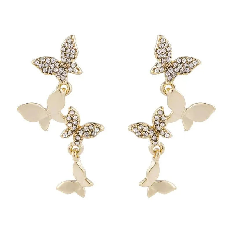 Women's copper butterfly drop earrings with four-element design and gold colour finish
