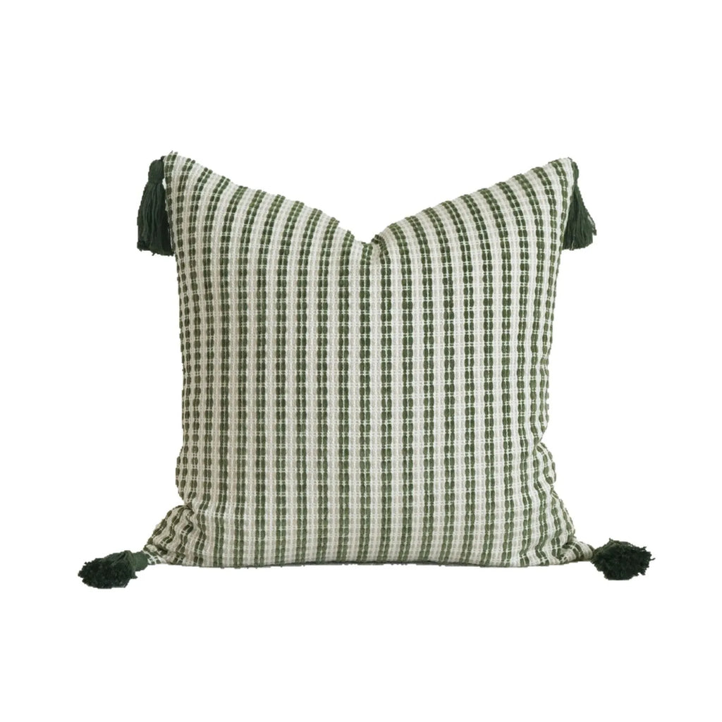 Green cotton and linen tassel hotel sample pillow with botanical patterns on a brushed fabric case