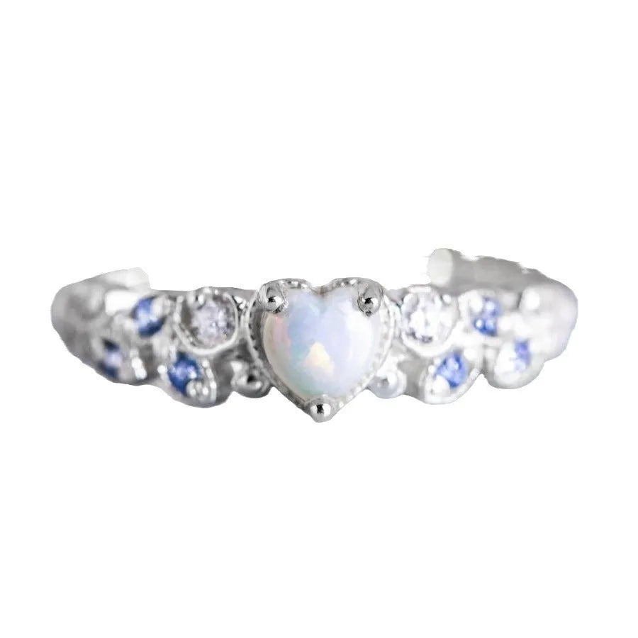White alloy women's ring with a detailed peach heart and opal flower design.