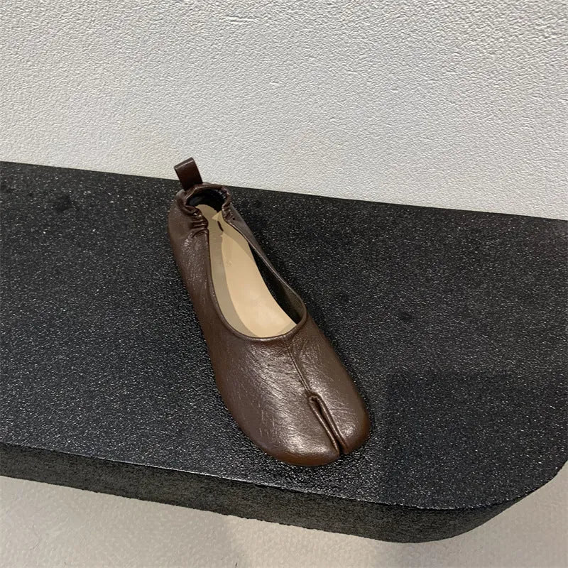 Women's apricot split toe chunky heel pumps with round toe and low heel on a white background.
