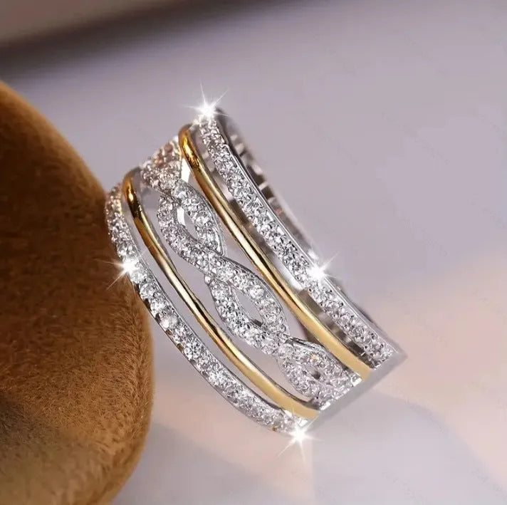 Platinum alloy wide face ring with hollow jeweled detailing, diamond treatment finish, women's ring