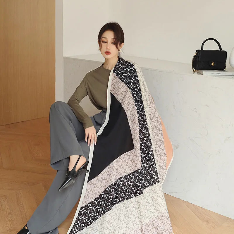 Women's vintage printed polyester scarf draped to show its 180cm length and 90cm width.