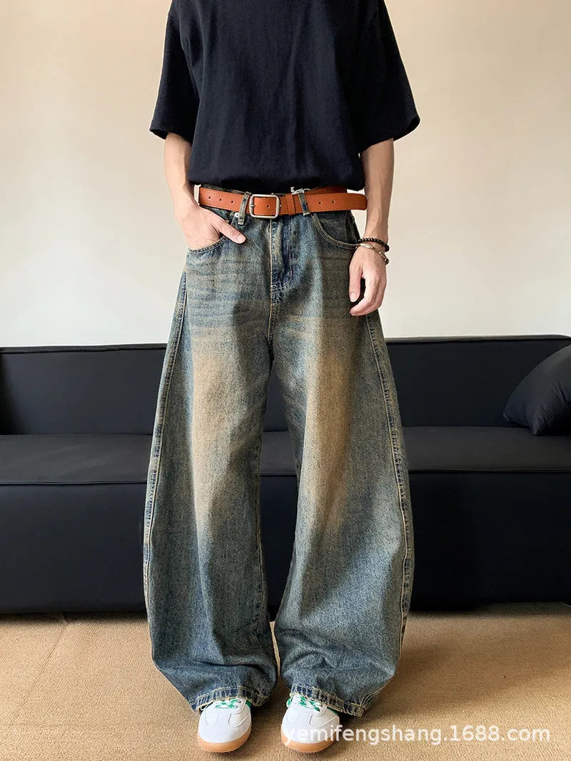 Men's retro blue distressed denim jeans with wide-leg silhouette and micro elasticity fabric