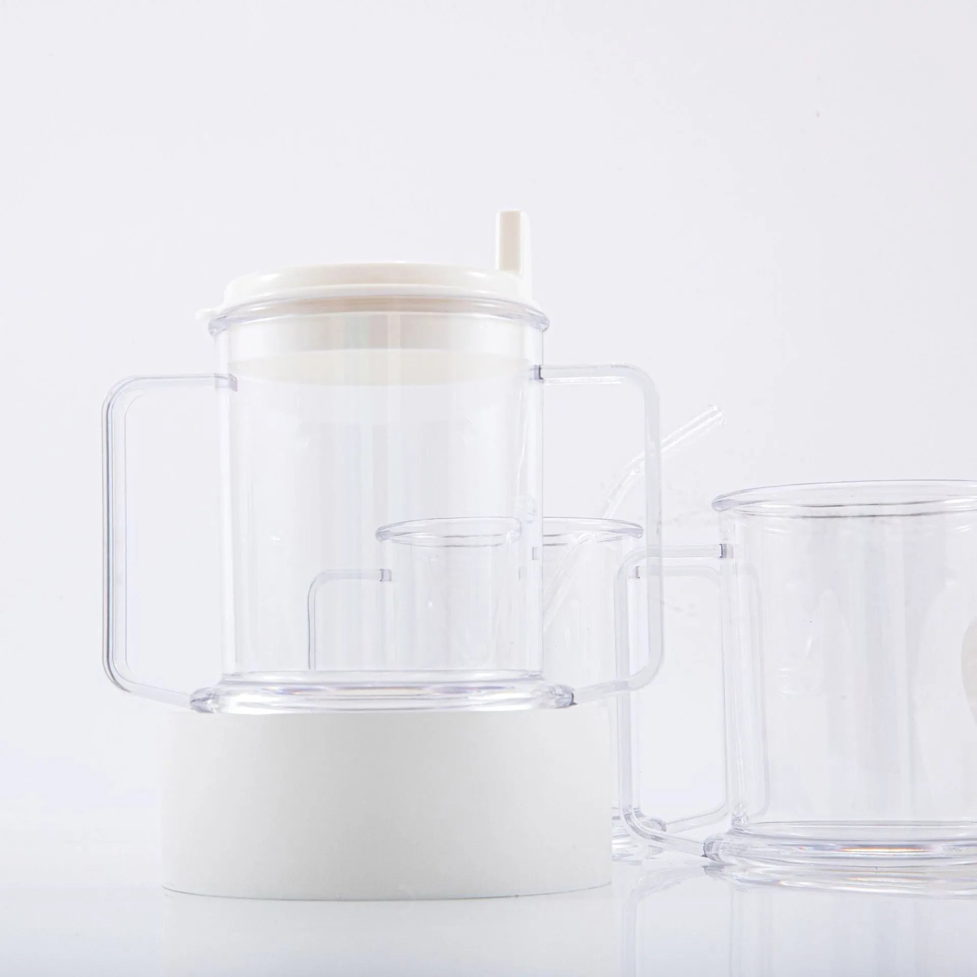 Transparent spill-proof drinking cup with modern design showing dimensions