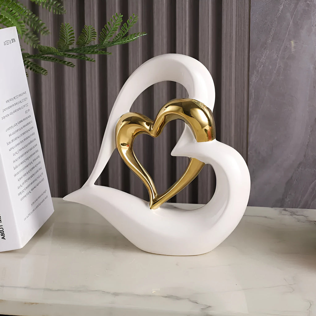 Modern geometric love heart ornament in white porcelain with metallic finish on display surface