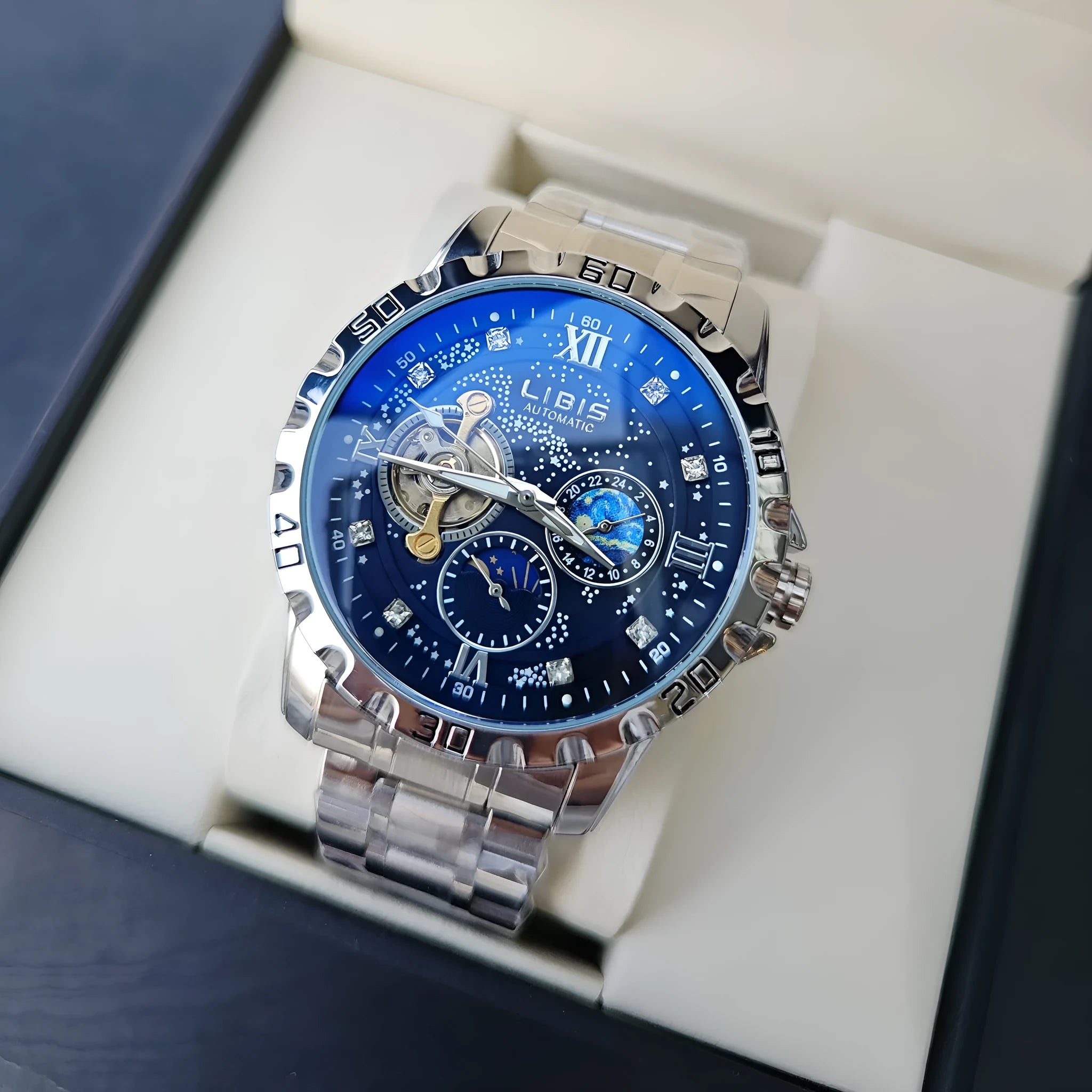 Men's silver automatic mechanical watch with starry dial, luminous hands, and black leather strap.