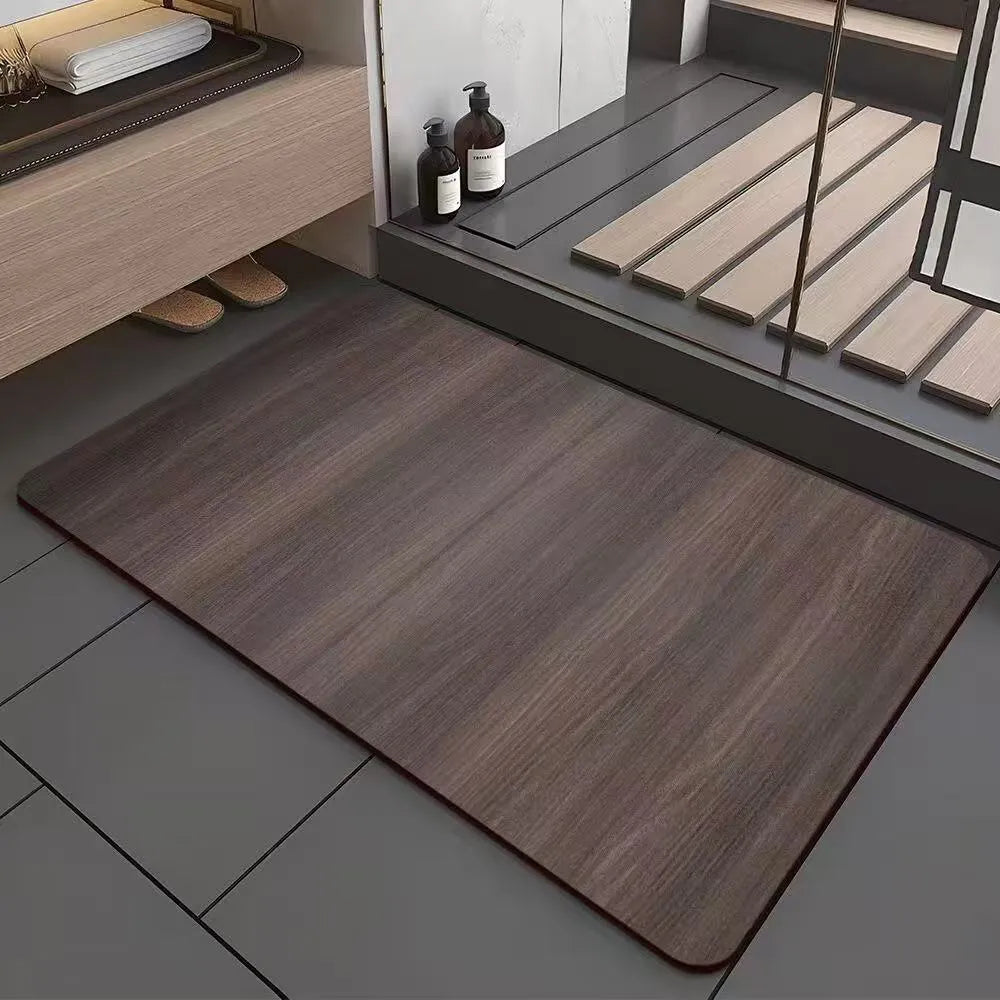 Square American-style diatom ooze floor mat with a geometric wood grain pattern in a bathroom setting.