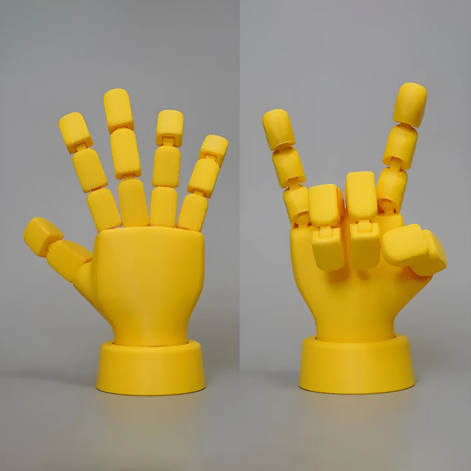 Yellow 3D printed hand ornament with movable joints and detailed sculpting