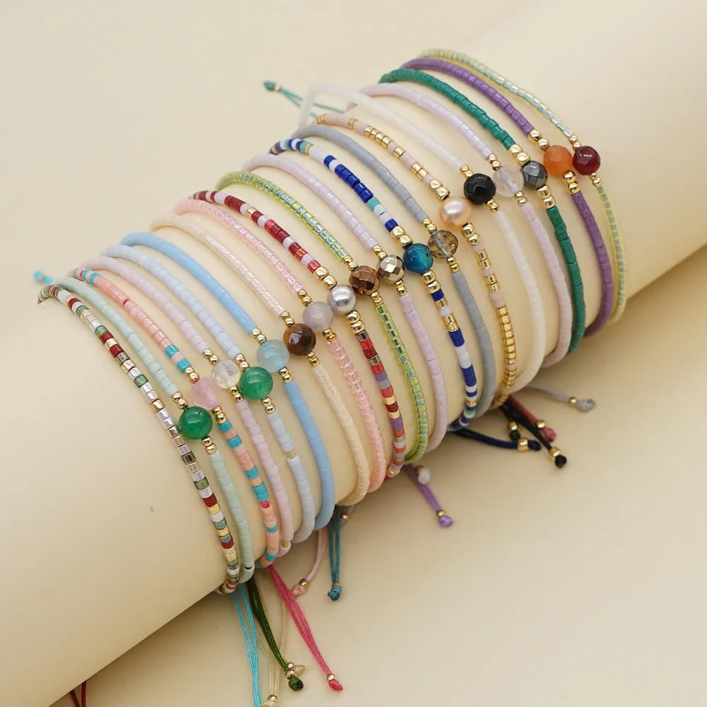 Handmade bohemian-style bracelet with colourful geometric glass beads for women.