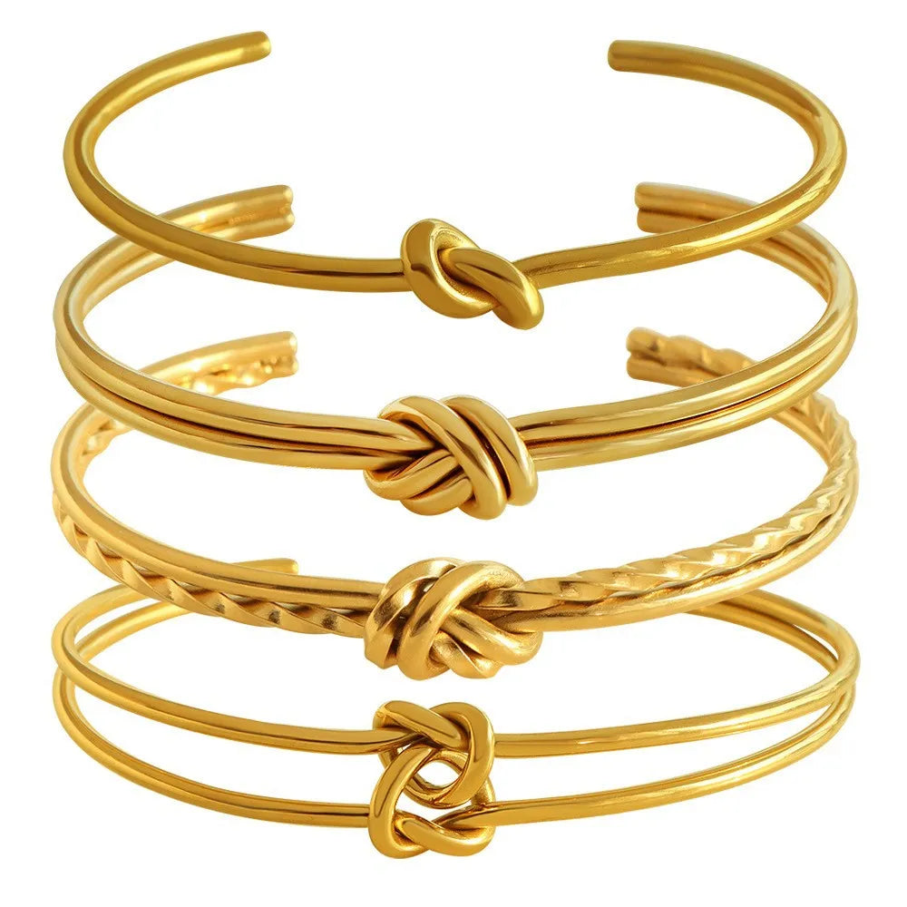 Women's stainless steel knotted C-shaped open double-layer bracelet in gold or silver tone.