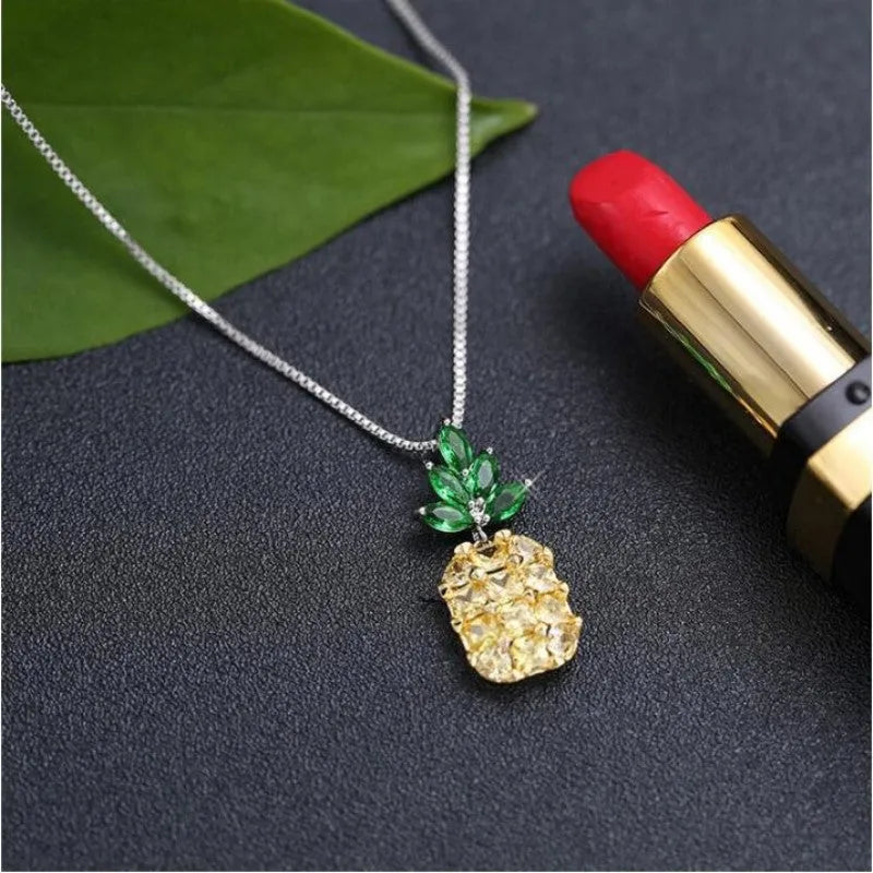 Women's geometric pineapple necklace with silver finish and detailed fruit charm