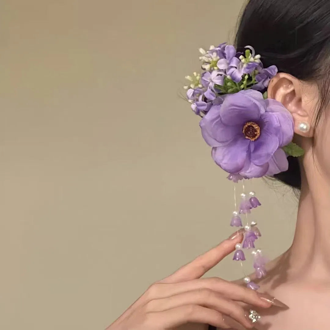 Women's floral tassel hair accessory with side clip in purple or yellow colour options