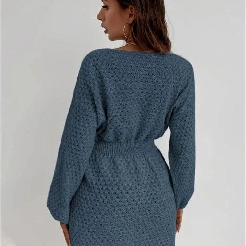 Blue women's knitted dress with fitted waist, French loose neck, and hand-crocheted flower decorations