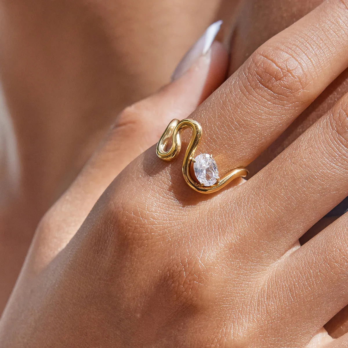 Geometric zircon ring with no-fade titanium steel finish in silver tone.
