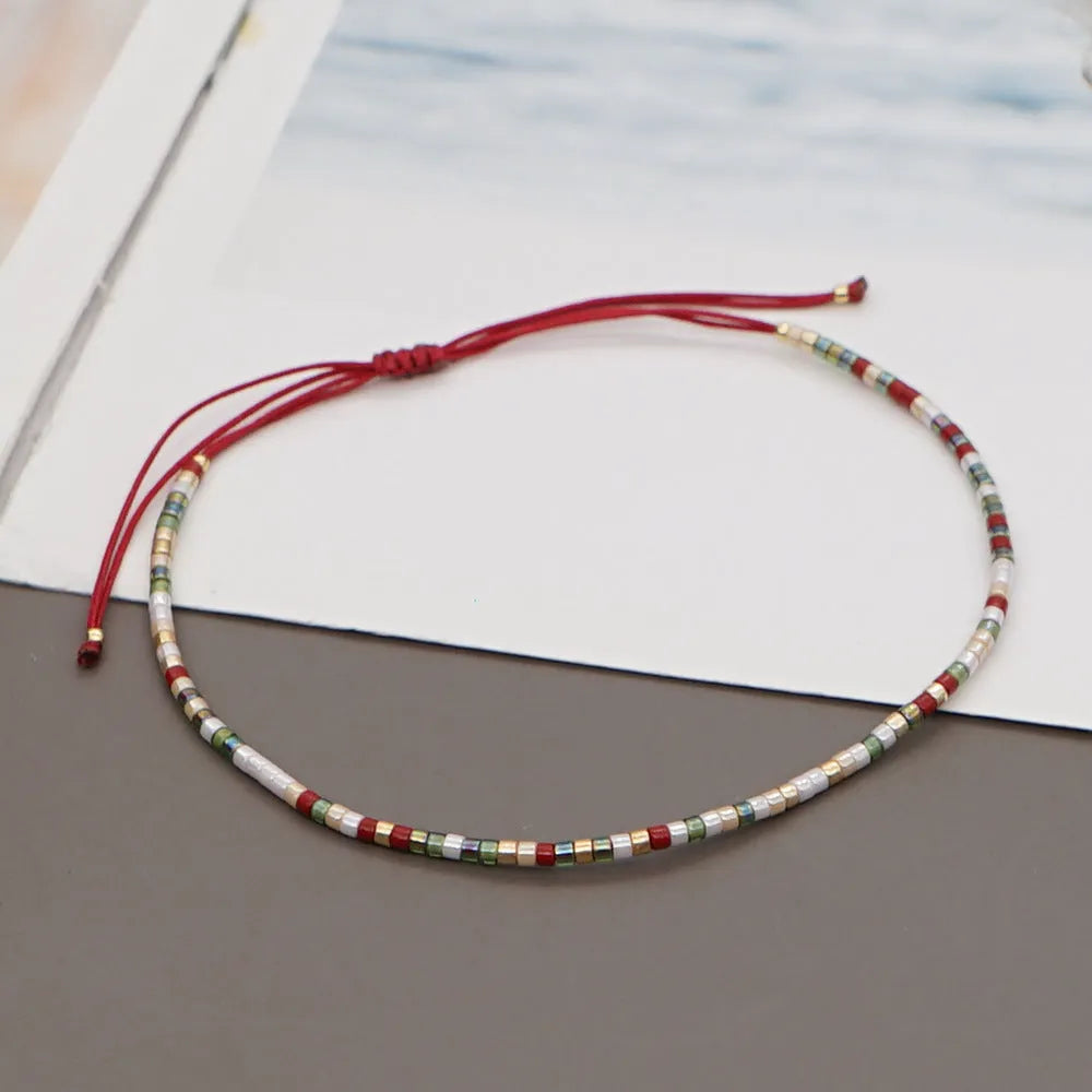 Handmade bohemian-style bracelet with colourful geometric glass beads for women.