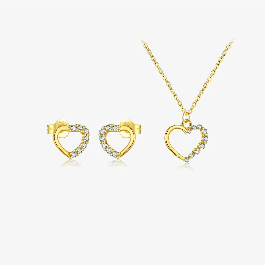 Sterling silver hollow heart and circle pendant necklace on a regular chain, shown in a gold tone finish.