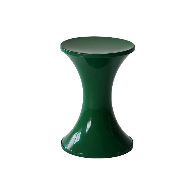Plastic hourglass-shaped shoe changing stool in selected colour, shown in a home entryway setting.