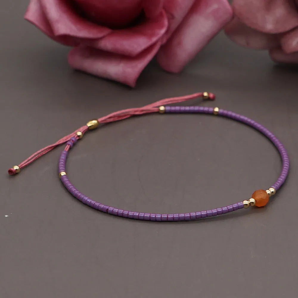 Handmade bohemian-style bracelet with colourful geometric glass beads for women.
