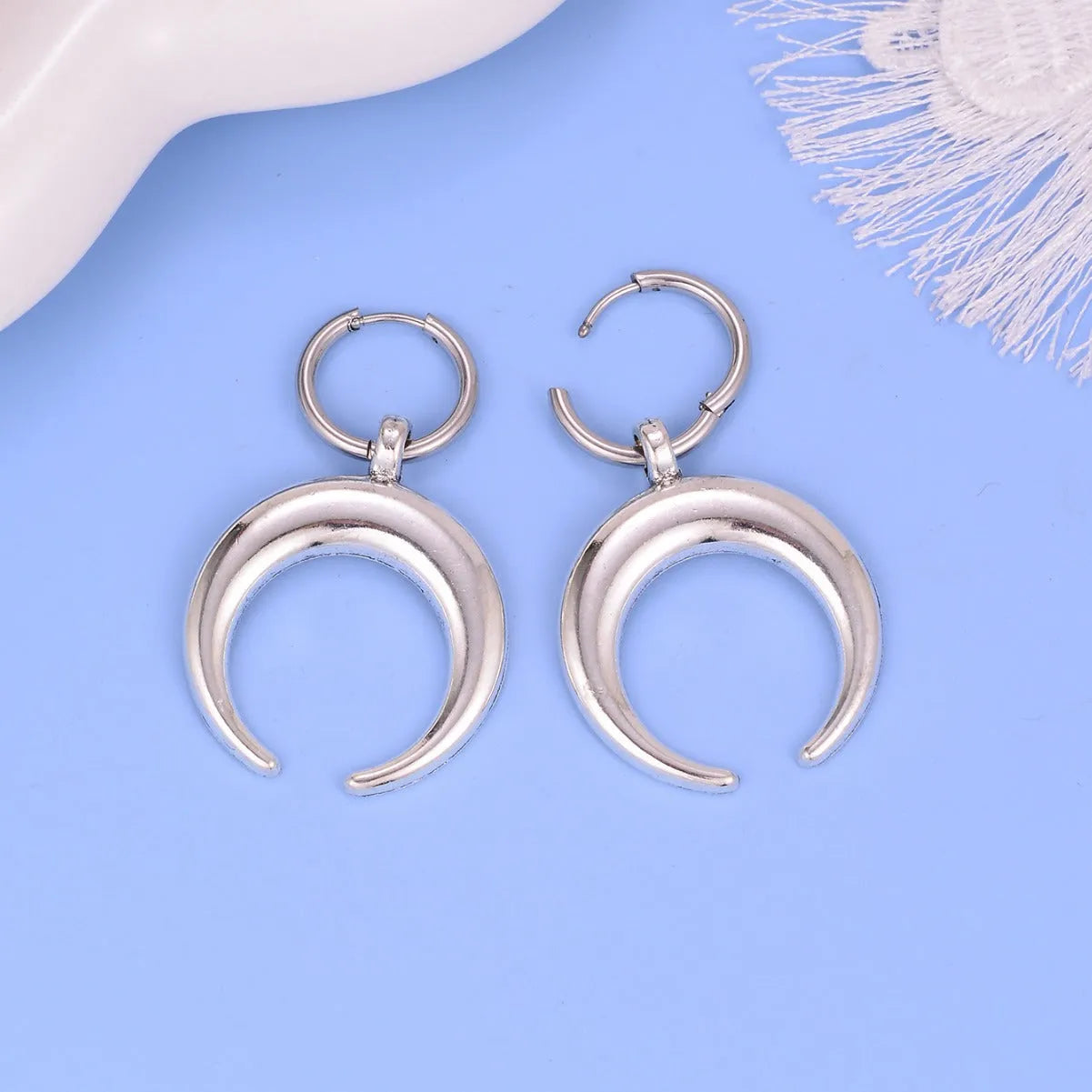 Silver vintage gothic moon large hoop earrings with geometric design and ear clip fastening