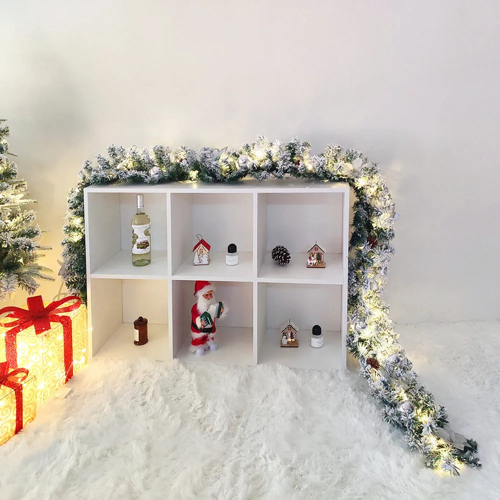 PVC Christmas rattan garland with flocked decoration in golden colour, draped to show texture and length.