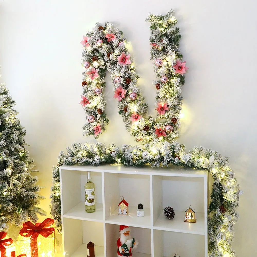 PVC Christmas rattan garland with flocked decoration in golden colour, draped to show texture and length.
