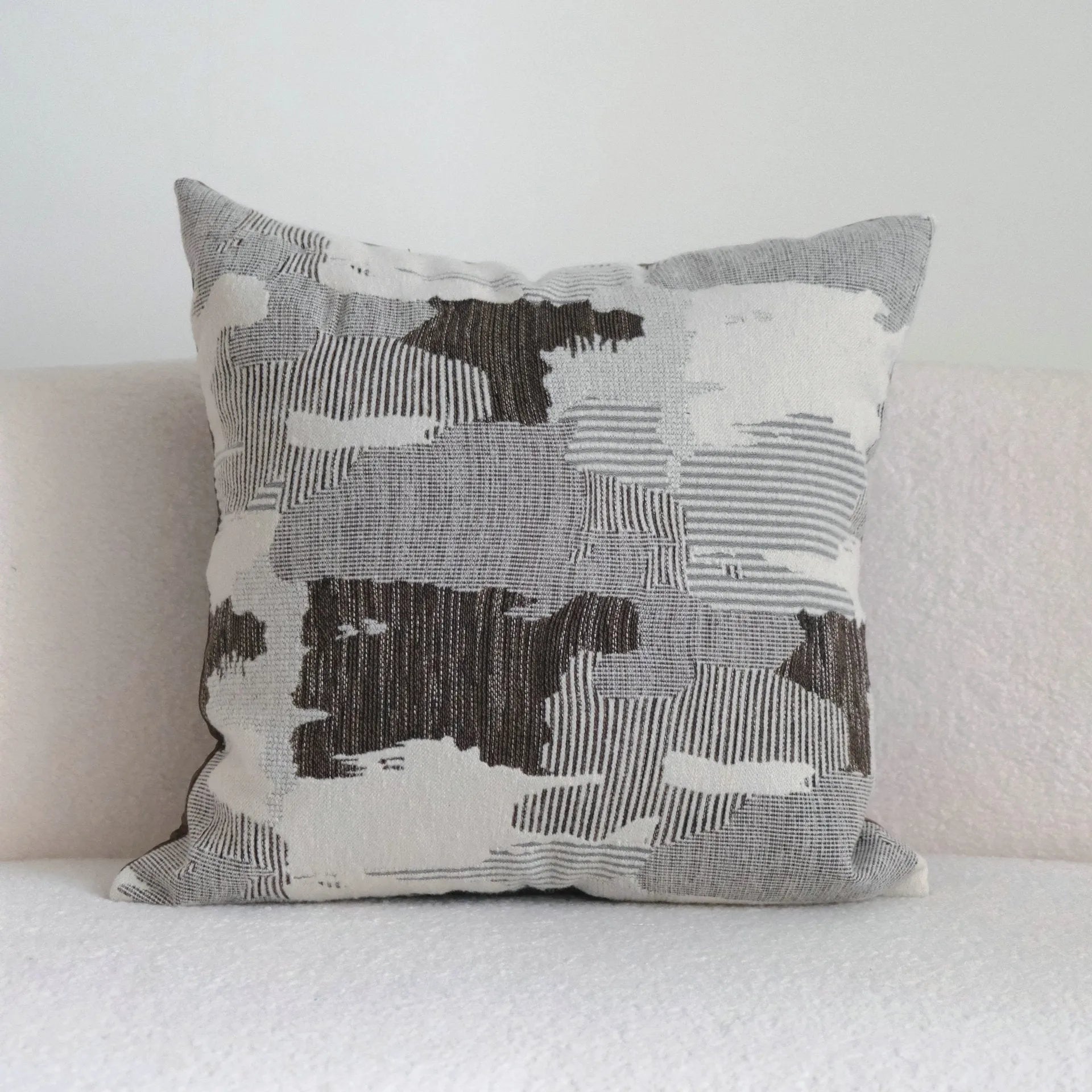 Coffee brown striped Chinese classical style pillow cushion on a sofa, shown in both square and waist pillow sizes.