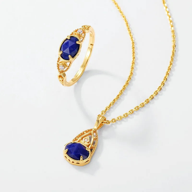 Women's ellipse geometric ring with round blue Lapis Lazuli stone on silver alloy band.