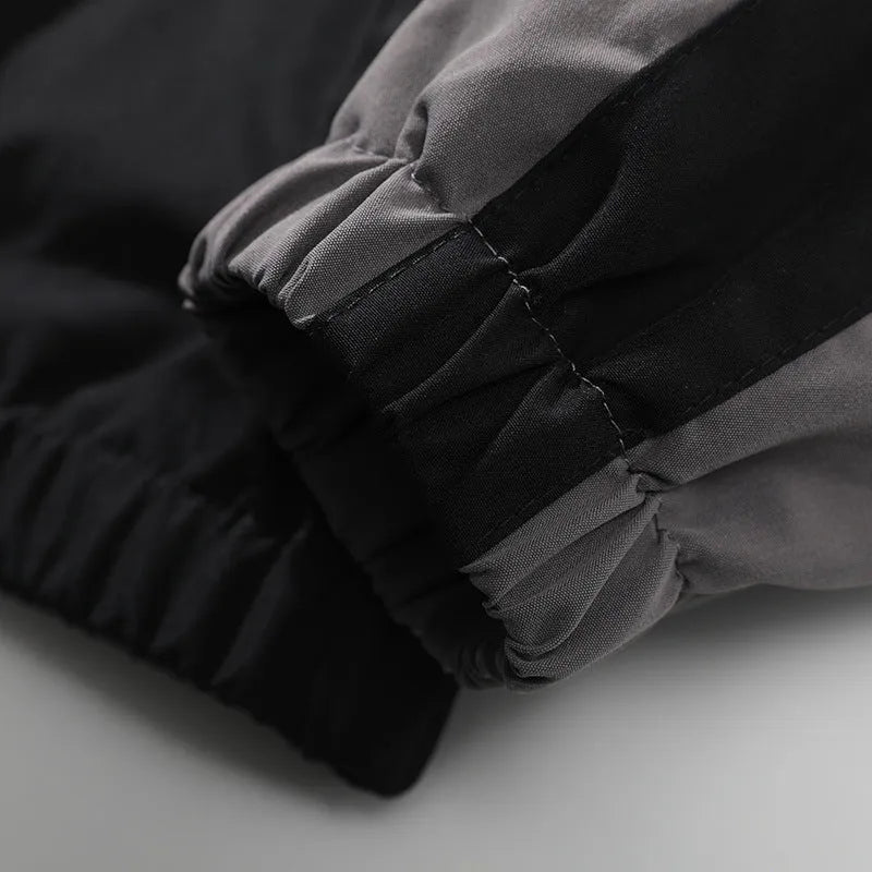 Men's black loose-fit casual jacket with contrast stitching and side pockets for spring and autumn.