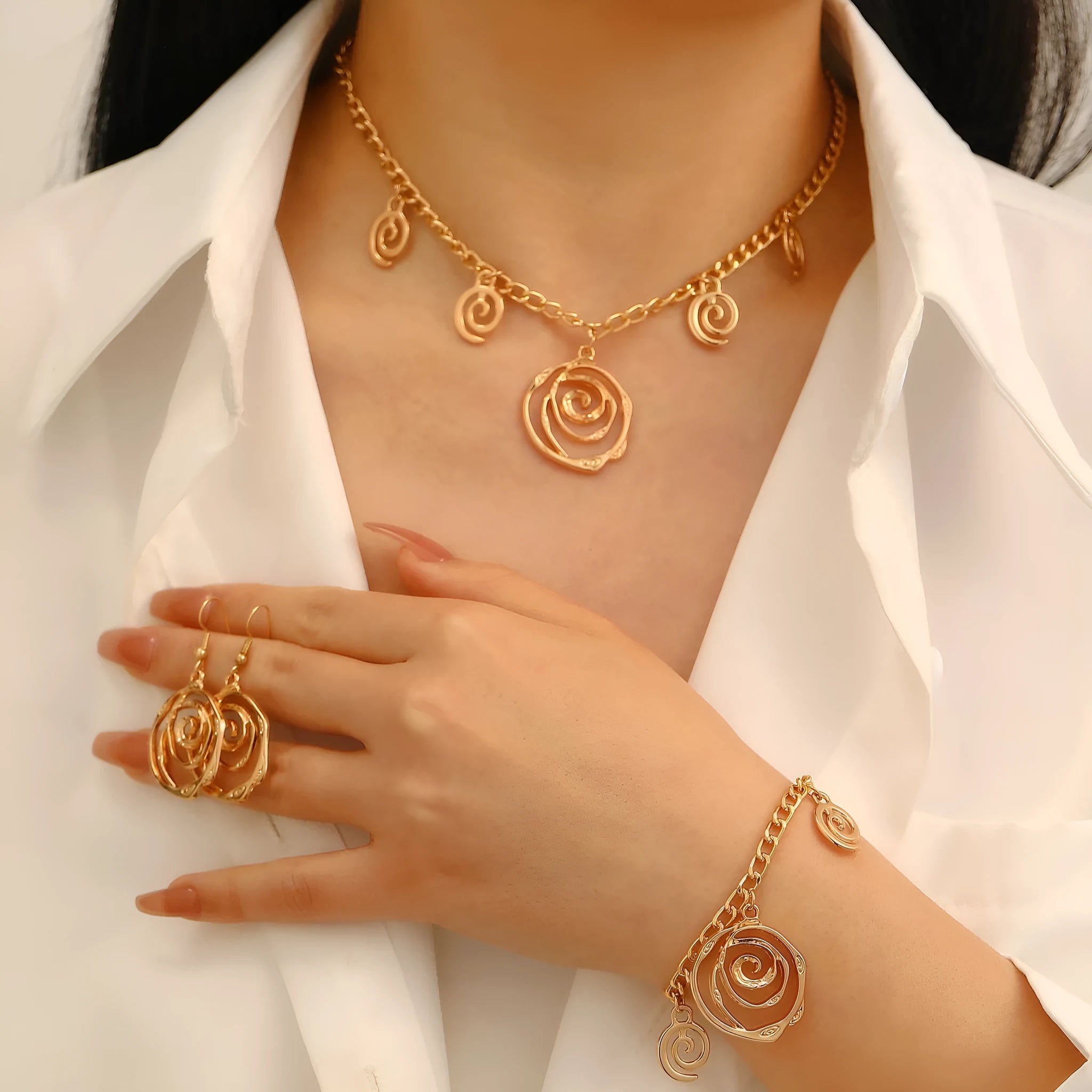 Geometric spiral donut jewellery set with necklace, bracelet, and earrings on adjustable 41-50cm chain
