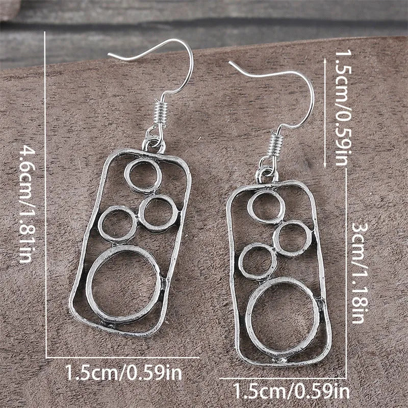 Geometric irregular square zinc alloy earrings with antique silver finish.